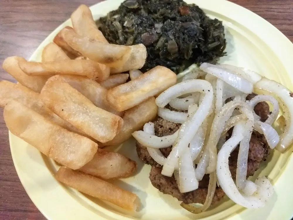 Hamburger Steak with Grilled Onions French Fries and Turnip Greens